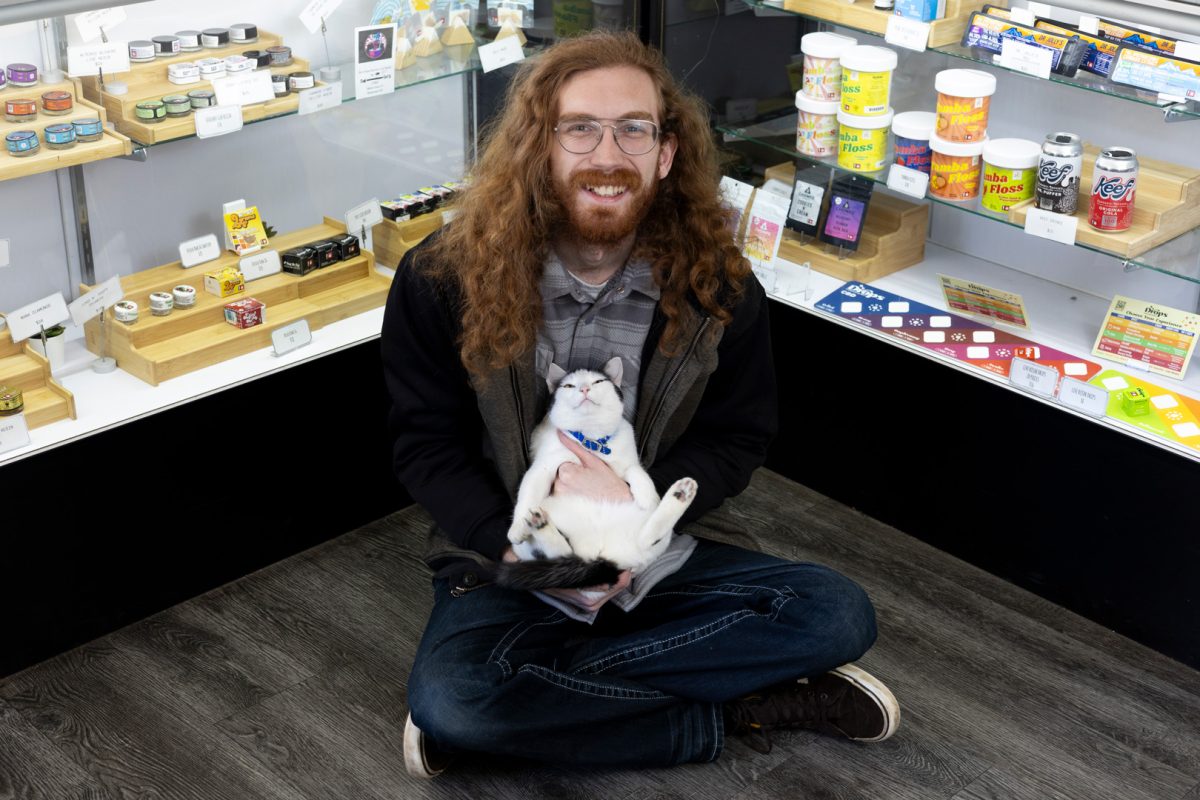 Newton poses with his cat, Indica, who “basically goes everywhere I go,” he said. Since joining the marijuana industry, Newton has seen the impacts on customers who use marijuana to relieve pain, anxiety, and other ailments — enough to the point that he trudged through the snow and ice of the recent winter storms in Eugene to keep Verde open. “I started smoking originally because I was treating my anxiety. And so for me, it's never been like, super-fun, get super blasted with your friends kind of thing,” he said. “I have a much easier time selling marijuana to an older person who is coming in here with ailments than a college student who is going to a party that night. Like that's just kind of why I started doing this — why I continue doing this.”